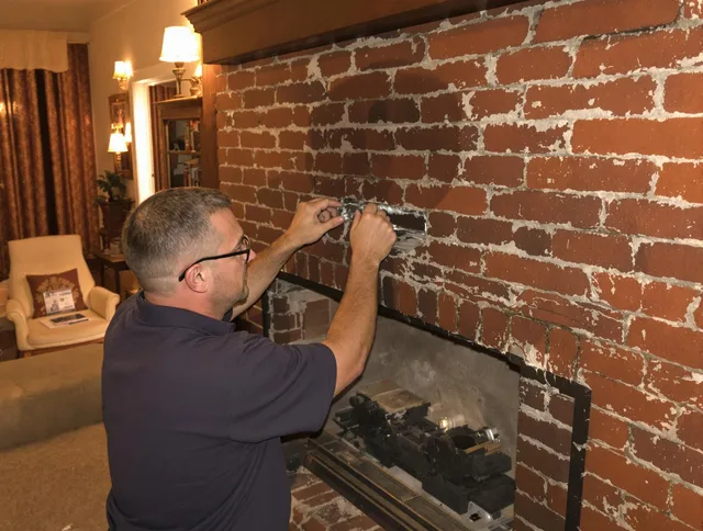 Seymour Chimney Sweep expert fixing a fireplace in Seymour, CT